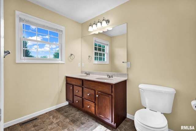 1129 Stonelake Ct, Metamora, IL 61548 - bathroom featuring baseboards and double vanity