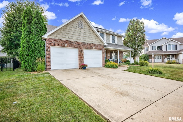 1129 Stonelake Ct, Metamora, IL 61548 - traditional-style house with brick siding, driveway, an attached garage, and covered porch