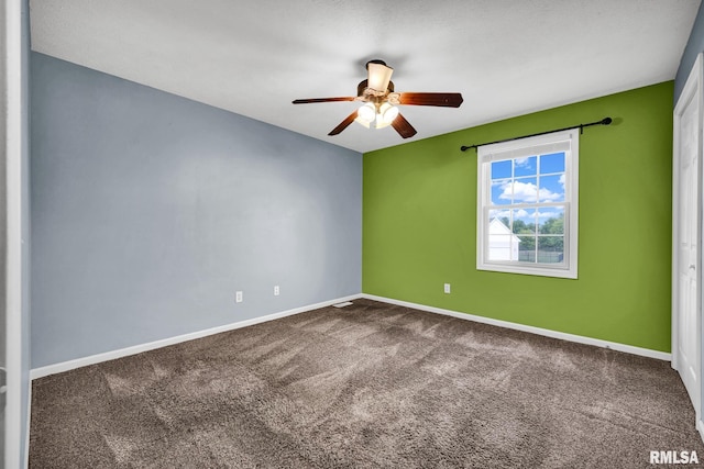 1129 Stonelake Ct, Metamora, IL 61548 - empty room with ceiling fan and dark carpet