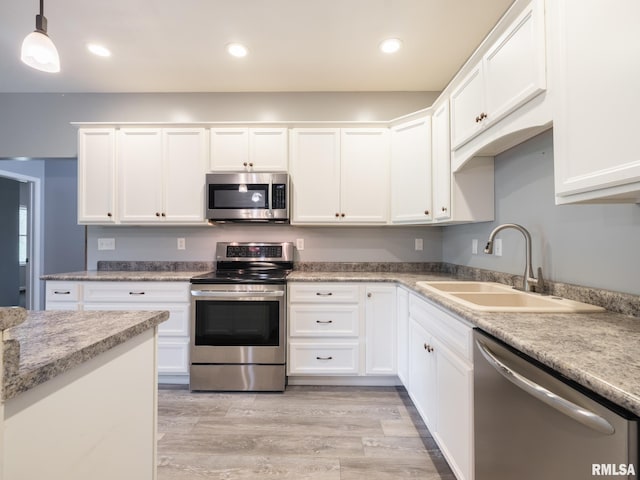 797 State Route 29th Hwy, Sparland, IL 61565 - kitchen featuring stainless steel appliances, white cabinets, hanging light fixtures, light wood-style floors, and recessed lighting