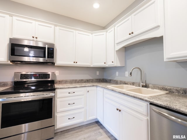 797 State Route 29th Hwy, Sparland, IL 61565 - kitchen with appliances with stainless steel finishes, white cabinets, light countertops, recessed lighting, and light wood-style floors