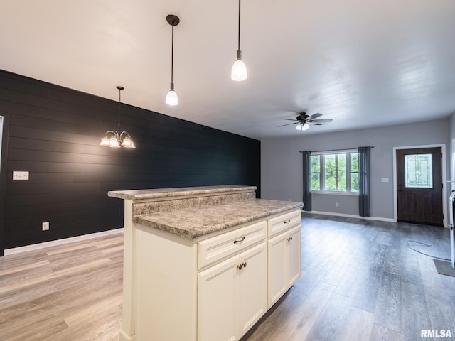 797 State Route 29th Hwy, Sparland, IL 61565 - kitchen featuring ceiling fan, light wood finished floors, open floor plan, light countertops, and white cabinets