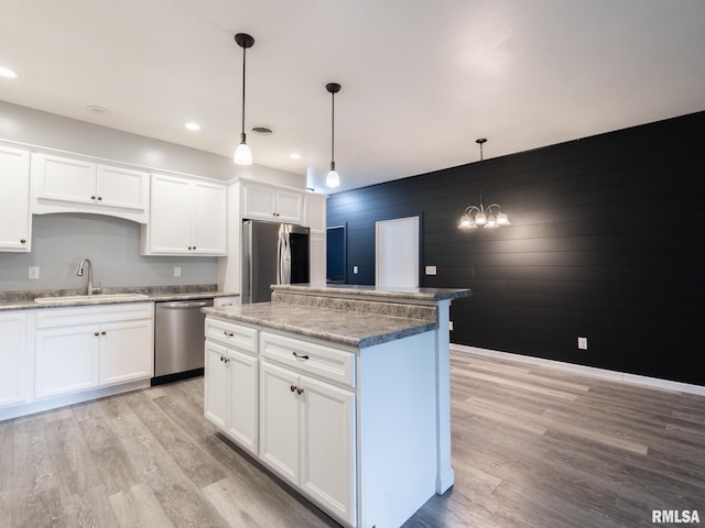 797 State Route 29th Hwy, Sparland, IL 61565 - kitchen featuring appliances with stainless steel finishes, light wood-type flooring, a kitchen island, white cabinets, and recessed lighting