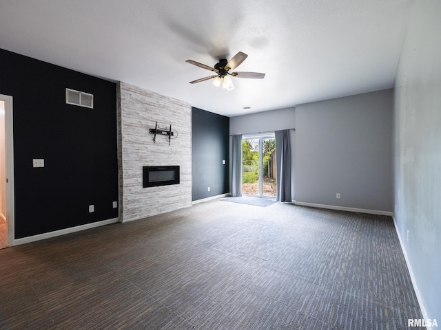 797 State Route 29th Hwy, Sparland, IL 61565 - unfurnished living room with carpet flooring, ceiling fan, and a fireplace