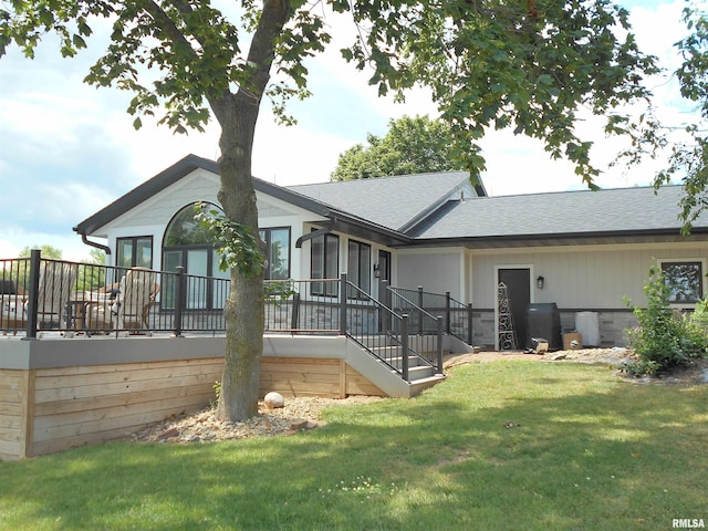 140 Palemino Ln, Avon, IL 61415 - back of property featuring a yard, a shingled roof, stairway, and a deck