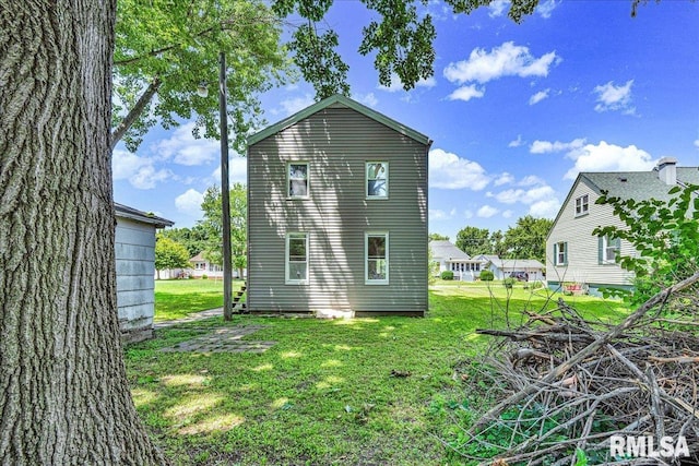 310 W Martin St, Abingdon, IL 61410 - back of property featuring a lawn