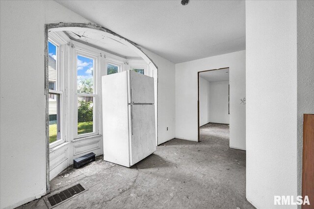 310 W Martin St, Abingdon, IL 61410 - spare room featuring plenty of natural light and a textured wall