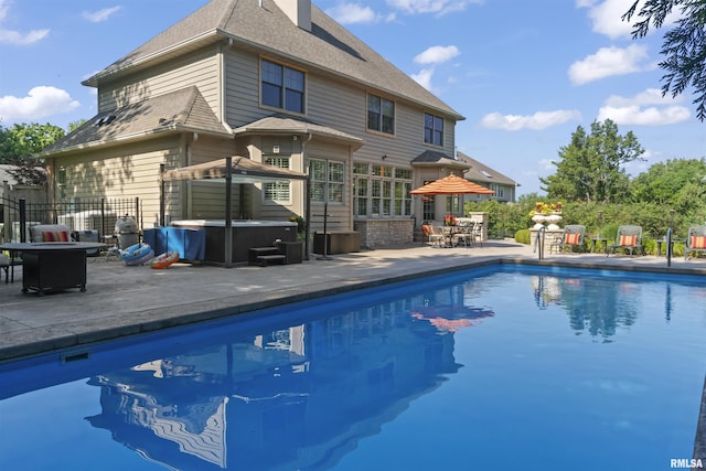 2815 W Windpointe Dr, Peoria, IL 61614 - outdoor pool featuring a hot tub and a patio area