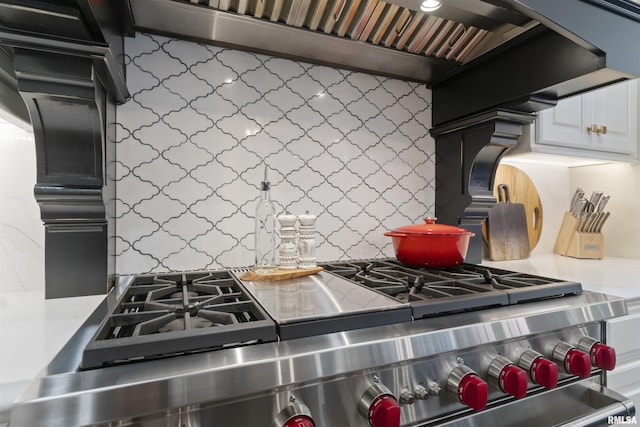 2815 W Windpointe Dr, Peoria, IL 61614 - kitchen view of stainless steel range, backsplash, and ventilation hood