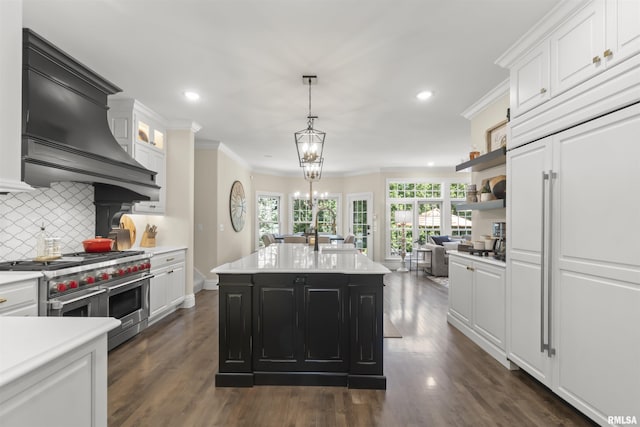 2815 W Windpointe Dr, Peoria, IL 61614 - kitchen with high quality appliances, light countertops, white cabinets, recessed lighting, and ornamental molding