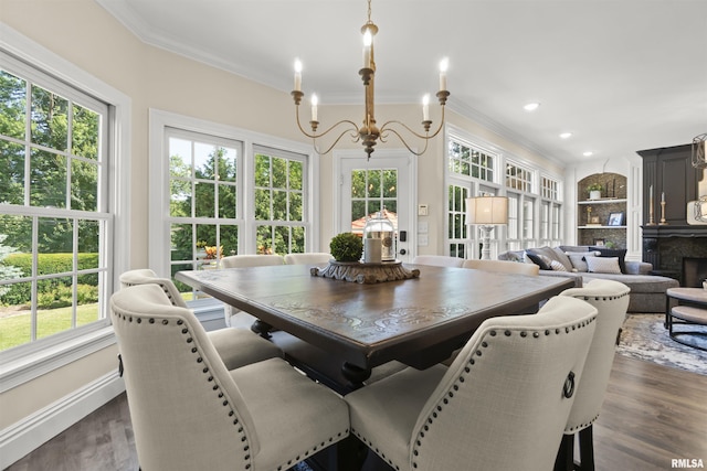 2815 W Windpointe Dr, Peoria, IL 61614 - dining area featuring healthy amount of natural light, dark wood-type flooring, crown molding, recessed lighting, and a chandelier