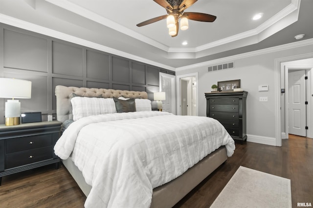 2815 W Windpointe Dr, Peoria, IL 61614 - bedroom with a tray ceiling, crown molding, recessed lighting, dark wood-style flooring, and ceiling fan