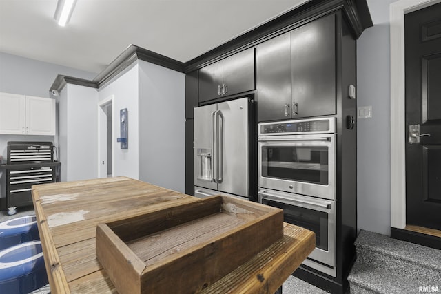 2815 W Windpointe Dr, Peoria, IL 61614 - kitchen with appliances with stainless steel finishes, dark cabinets, and white cabinetry