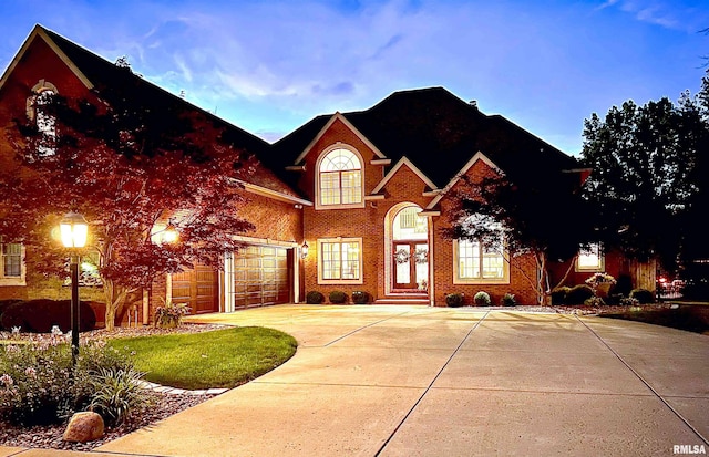2815 W Windpointe Dr, Peoria, IL 61614 - traditional-style home featuring concrete driveway and brick siding