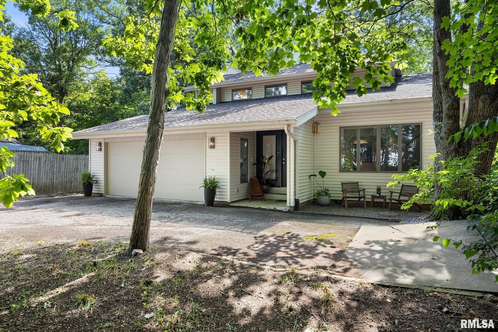 1434 W Grandridge Ct, Dunlap, IL 61525 - view of front facade with an attached garage, driveway, and roof with shingles