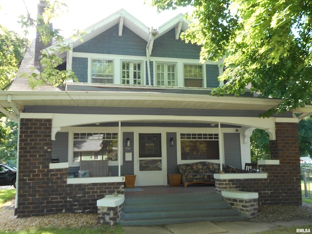 994 N Crafford St, Bushnell, IL 61422 - craftsman-style home with covered porch and brick siding