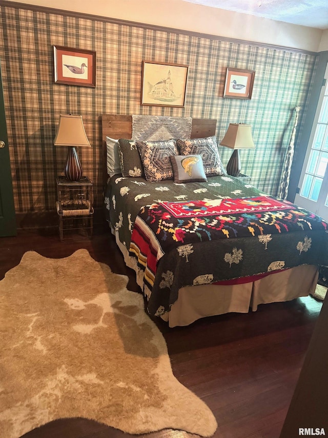 994 N Crafford St, Bushnell, IL 61422 - bedroom with wallpapered walls and wood finished floors