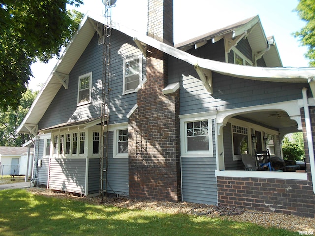 994 N Crafford St, Bushnell, IL 61422 - back of property featuring a chimney and covered porch