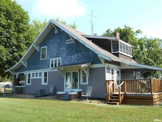 994 N Crafford St, Bushnell, IL 61422 - back of property featuring entry steps, a yard, a chimney, and a wooden deck