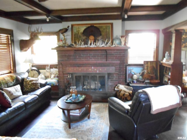 994 N Crafford St, Bushnell, IL 61422 - living room featuring beam ceiling, plenty of natural light, and a fireplace