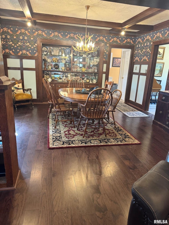 994 N Crafford St, Bushnell, IL 61422 - dining room featuring wallpapered walls, wood-type flooring, a chandelier, beam ceiling, and coffered ceiling
