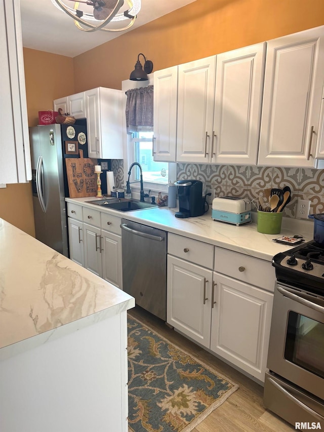 994 N Crafford St, Bushnell, IL 61422 - kitchen with stainless steel appliances, white cabinets, and tasteful backsplash
