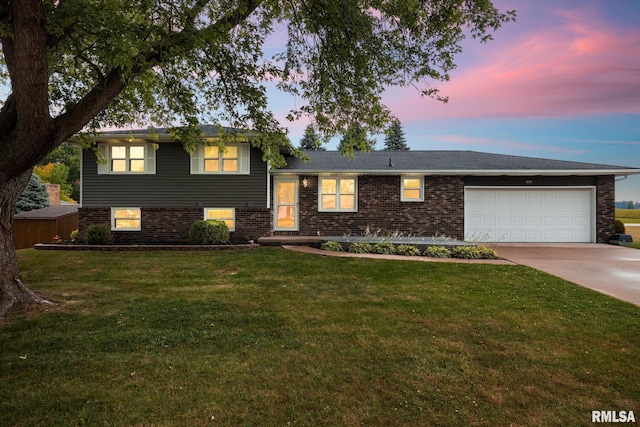 524 Crestview Dr, Metamora, IL 61548 - tri-level home featuring an attached garage, brick siding, concrete driveway, and a yard