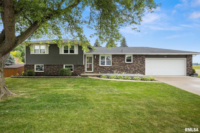 524 Crestview Dr, Metamora, IL 61548 - tri-level home featuring an attached garage, driveway, a front yard, and brick siding