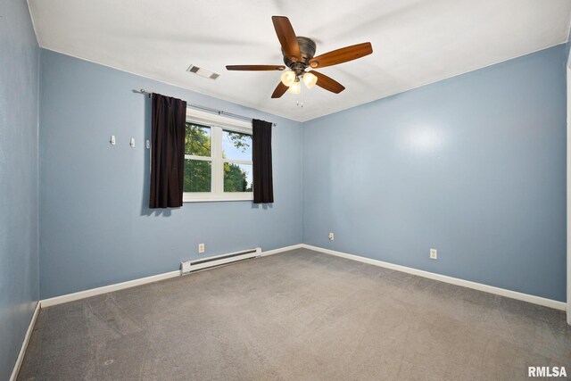 524 Crestview Dr, Metamora, IL 61548 - spare room with a baseboard heating unit, ceiling fan, and carpet flooring