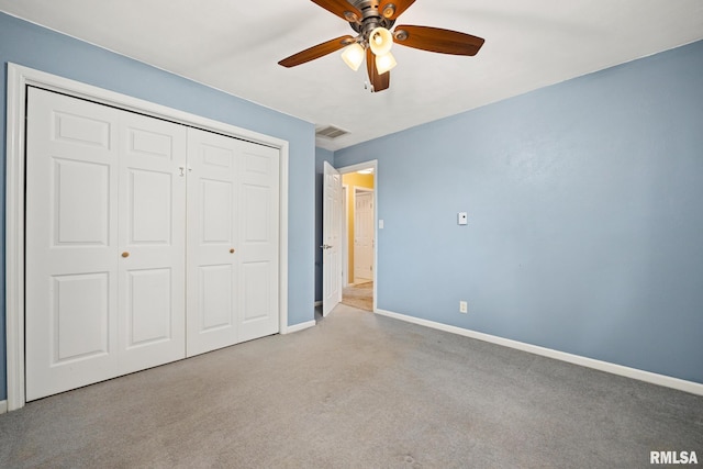 524 Crestview Dr, Metamora, IL 61548 - unfurnished bedroom featuring carpet, a closet, and ceiling fan