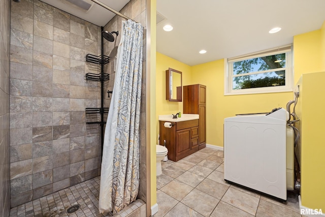 524 Crestview Dr, Metamora, IL 61548 - bathroom with washer / dryer, vanity, a tile shower, recessed lighting, and tile patterned flooring
