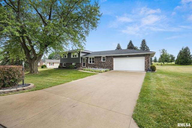 524 Crestview Dr, Metamora, IL 61548 - tri-level home featuring an attached garage, concrete driveway, a front yard, and brick siding
