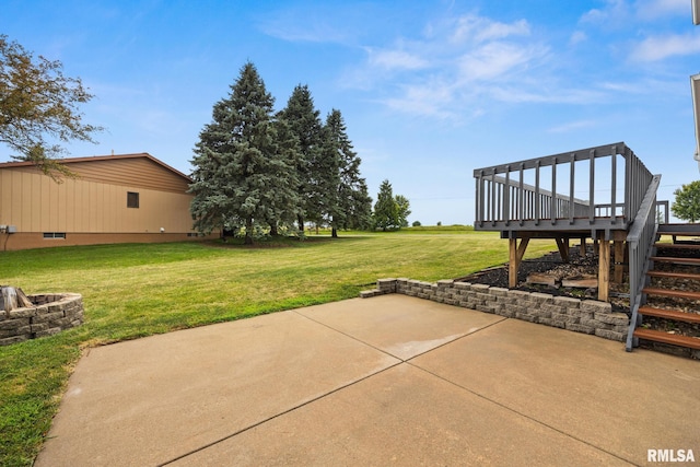 524 Crestview Dr, Metamora, IL 61548 - view of green lawn featuring a patio, a fire pit, a deck, and stairway