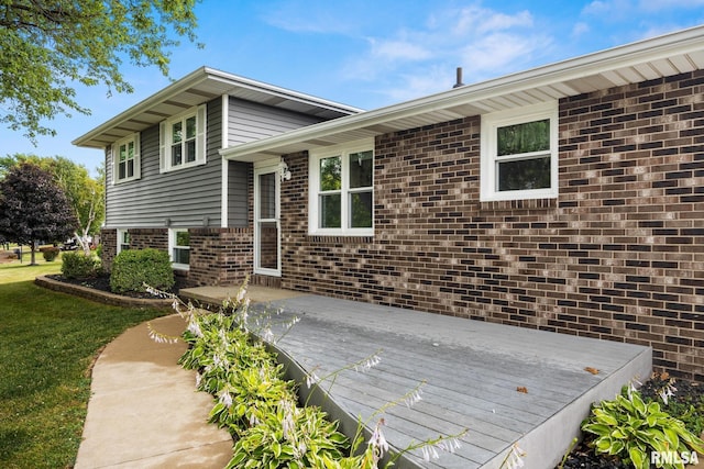 524 Crestview Dr, Metamora, IL 61548 - exterior space featuring a wooden deck, brick siding, and a yard