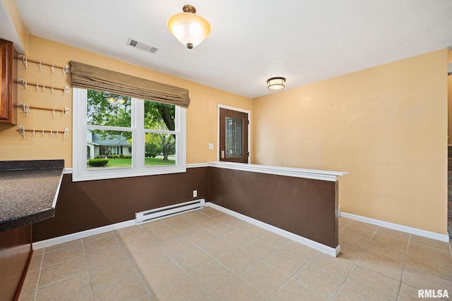 524 Crestview Dr, Metamora, IL 61548 - unfurnished dining area featuring a baseboard radiator and light tile patterned floors