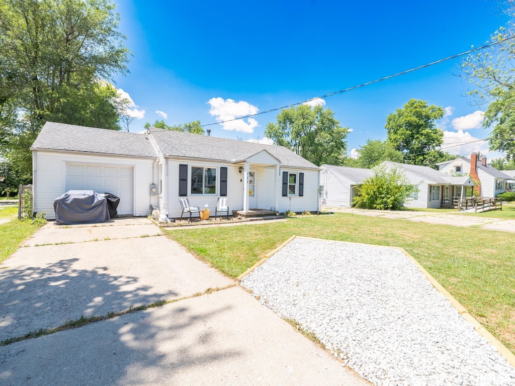 111 Stahl Ave, Washington, IL 61571 - ranch-style house with driveway, a front yard, and a garage