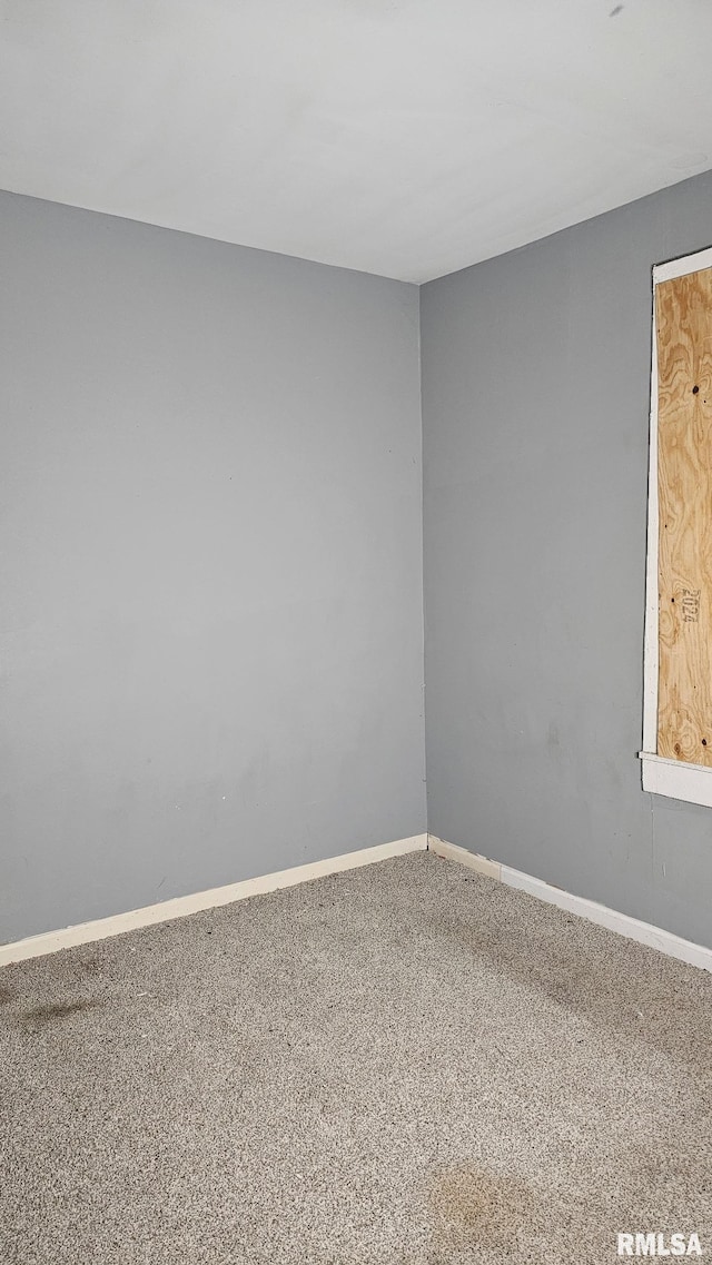 1509 S Western Ave, Peoria, IL 61605 - carpeted empty room with baseboards
