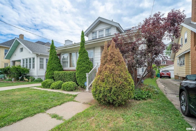 1922 W Rohmann Ave, West Peoria, IL 61604 - bungalow with a front lawn