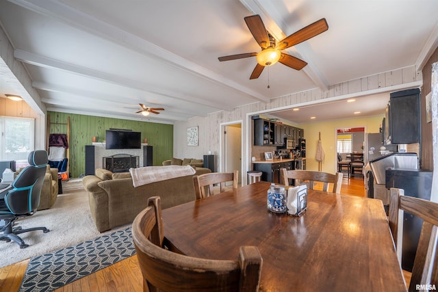 1922 W Rohmann Ave, West Peoria, IL 61604 - dining area with a ceiling fan, wood finished floors, beam ceiling, a fireplace, and ornamental molding