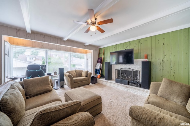 1922 W Rohmann Ave, West Peoria, IL 61604 - living room featuring beam ceiling, ceiling fan, wooden walls, carpet flooring, and a fireplace