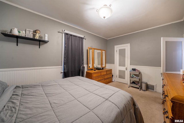 1922 W Rohmann Ave, West Peoria, IL 61604 - bedroom with a wainscoted wall, light carpet, and ornamental molding