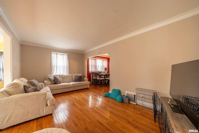 1922 W Rohmann Ave, West Peoria, IL 61604 - living area with arched walkways, hardwood / wood-style floors, and crown molding