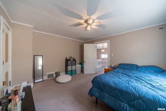 1922 W Rohmann Ave, West Peoria, IL 61604 - bedroom with light carpet, ceiling fan, and crown molding