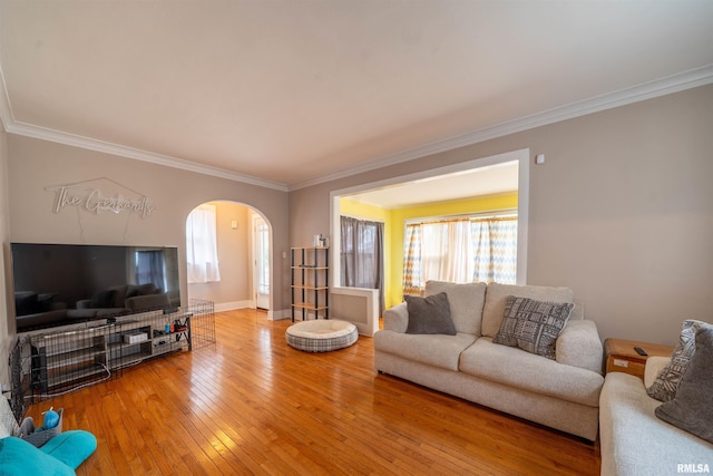 1922 W Rohmann Ave, West Peoria, IL 61604 - living room featuring arched walkways, wood-type flooring, and ornamental molding
