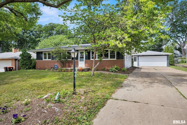 3819 N Saymore Ln, Peoria, IL 61615 - view of front of home featuring brick siding, a garage, a front yard, and driveway