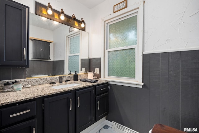 3819 N Saymore Ln, Peoria, IL 61615 - bathroom featuring vanity and a baseboard radiator