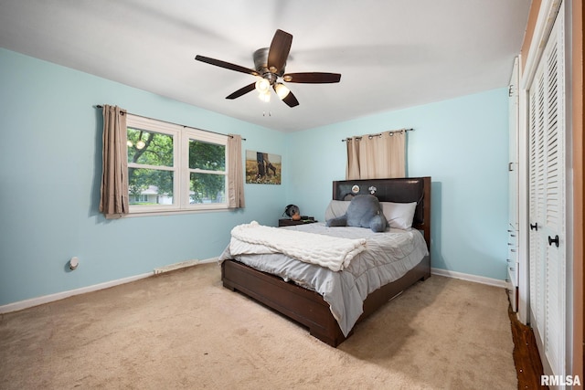 3819 N Saymore Ln, Peoria, IL 61615 - carpeted bedroom with baseboards and a ceiling fan