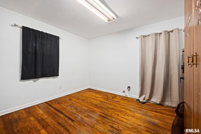 3819 N Saymore Ln, Peoria, IL 61615 - unfurnished room with wood finished floors and baseboards