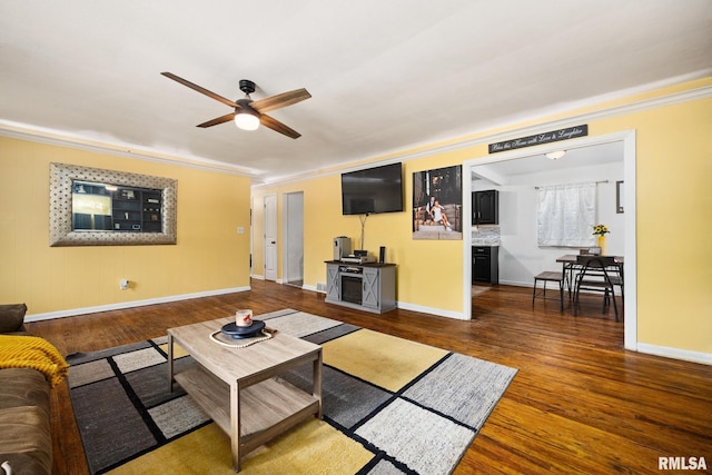 3819 N Saymore Ln, Peoria, IL 61615 - living room featuring ceiling fan, ornamental molding, and wood finished floors