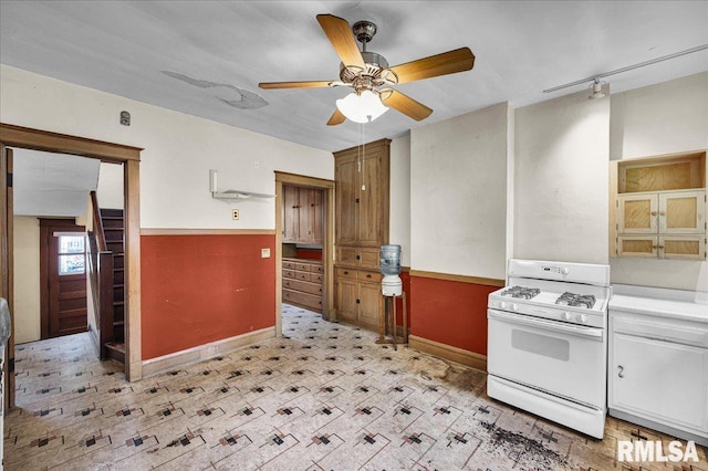 1027 N Maplewood Ave, Peoria, IL 61606 - kitchen featuring white gas stove, ceiling fan, light countertops, and light flooring